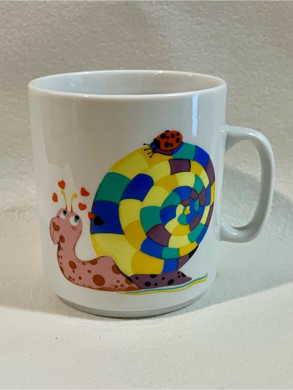 White Ceramic Mug with Colorful Snail Design